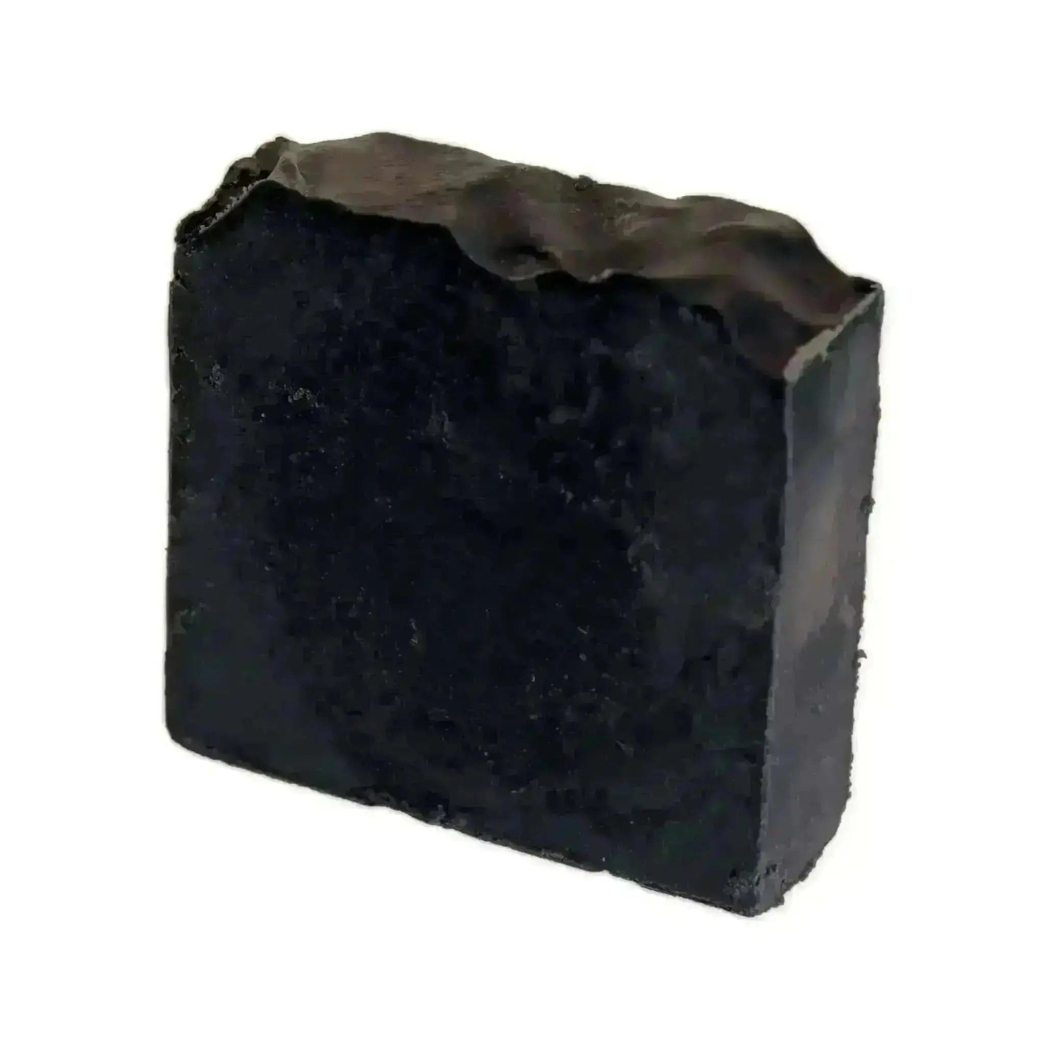 a black block of soap on a white background
