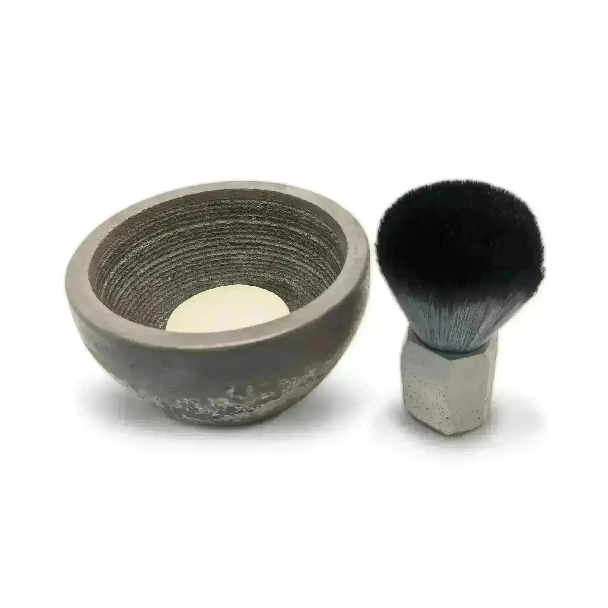 a shaving brush and bowl on a white background