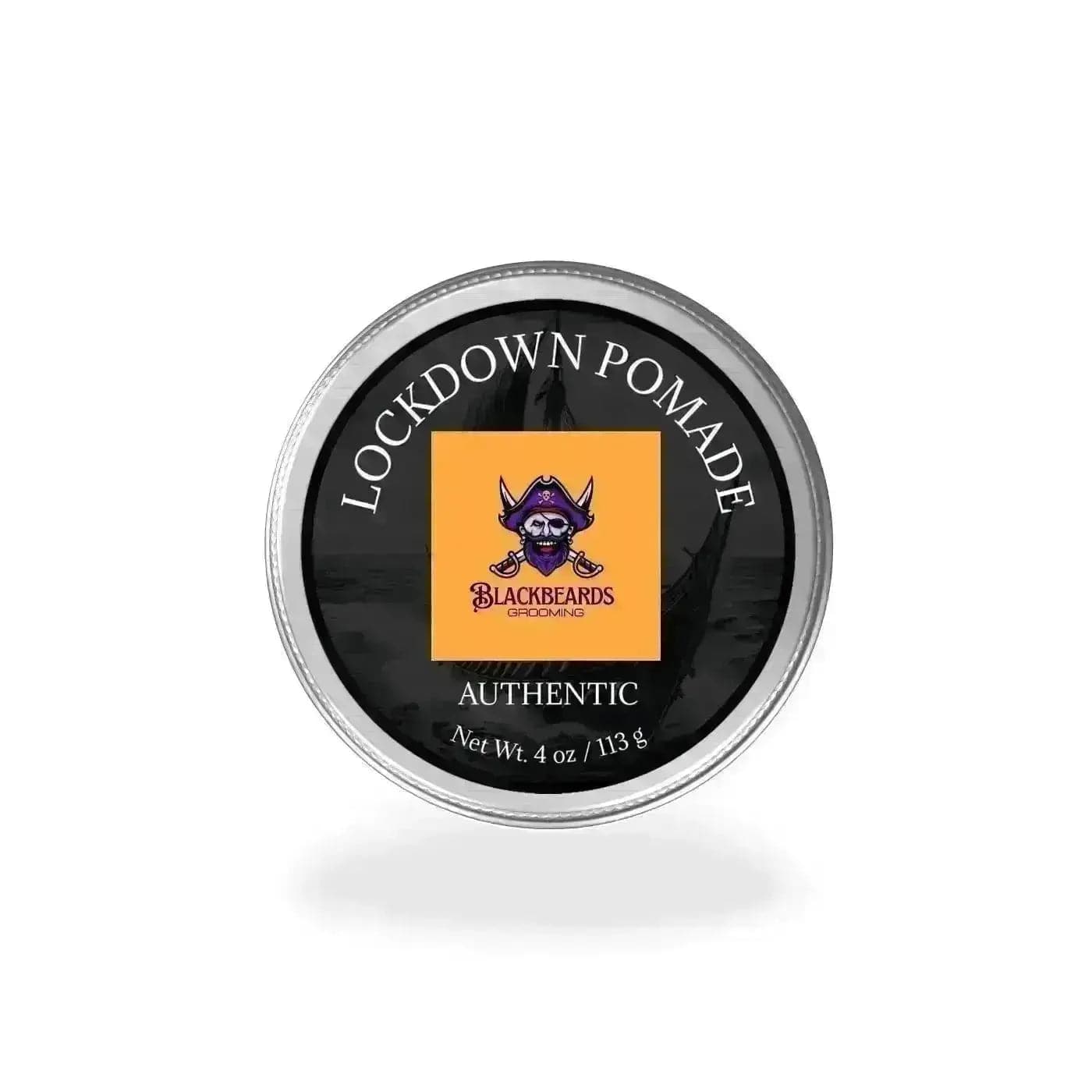 a black and orange tin with the words lockdown pomade on it